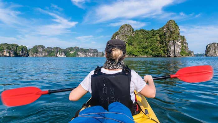 Kayaking on a Halong Bay cruise tour