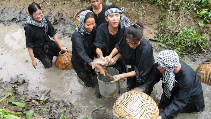 Joyfully catching fish in the Mekong Delta