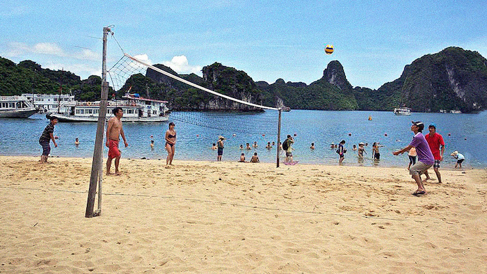 Playing volleyball in Halong Bay