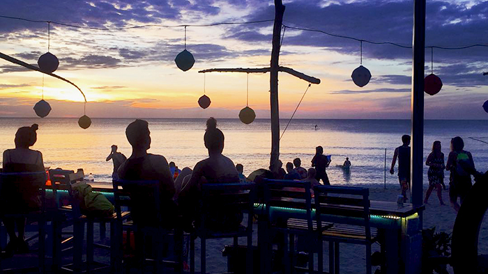 Enjoy the sunset at a bar